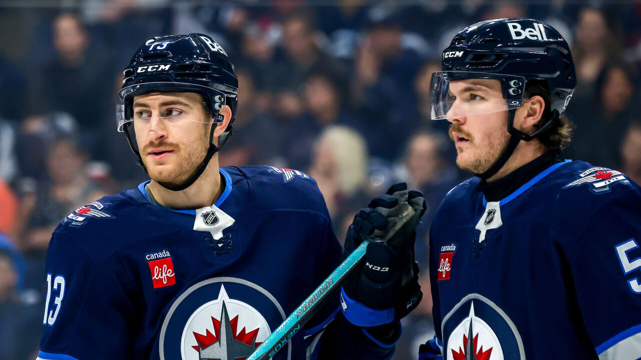 WINNIPEG, CANADA - NOVEMBER 19: Gabriel Vilardi #13 and Dylan Samberg #54 of the Winnipeg Jets look on during a first period stoppage of play against the Florida Panthers at Canada Life Centre on November 19, 2024 in Winnipeg, Manitoba, Canada.