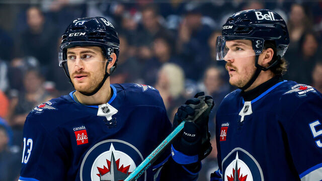 WINNIPEG, CANADA - NOVEMBER 19: Gabriel Vilardi #13 and Dylan Samberg #54 of the Winnipeg Jets look on during a first period stoppage of play against the Florida Panthers at Canada Life Centre on November 19, 2024 in Winnipeg, Manitoba, Canada.