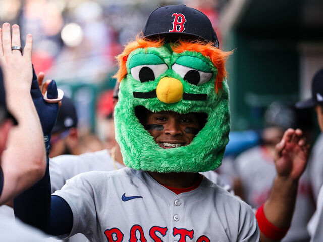 WASHINGTON, DC - JULY 05: Ceddanne Rafaela #3 of the Boston Red Sox celebrates with teammates while wearing a green monster head after hitting a a two run home run against the Washington Nationals during the third inning at Nationals Park on July 5, 2025 in Washington, DC.