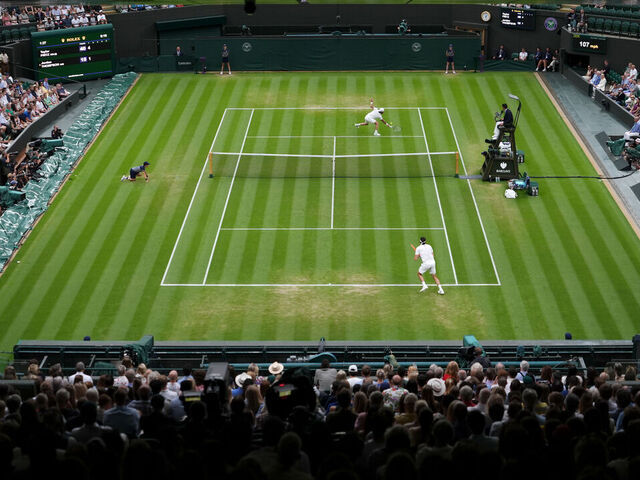 Spectators view the Gentlemen's Singles match between Jordan Thompson (top) and Taylor Fritz on day seven of the 2025 Wimbledon Championships at the All England Lawn Tennis and Croquet Club, London. Picture date: Sunday July 6, 2025.