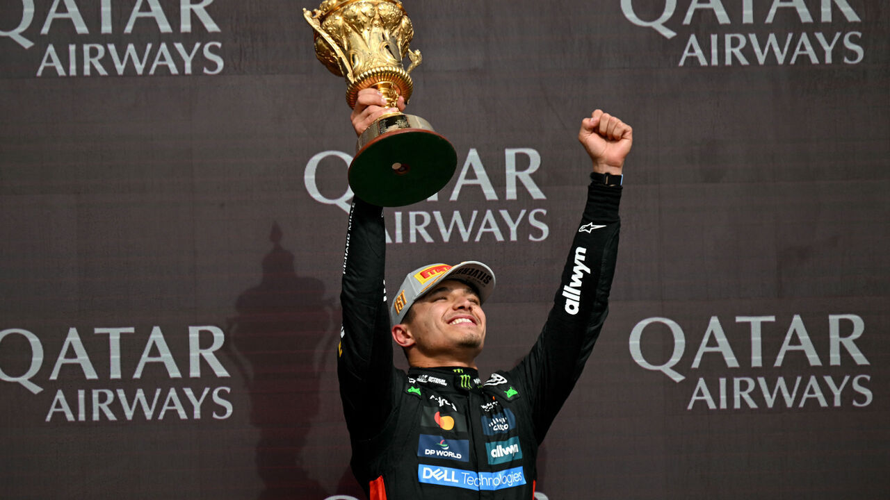 McLaren's British driver Lando Norris lifts the first place trophy after winning the Formula One British Grand Prix at the Silverstone motor racing circuit in Silverstone, central England, on July 6, 2025.