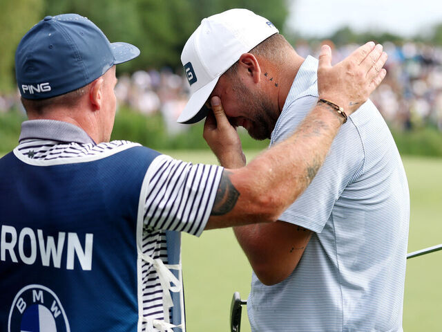 MUNICH, GERMANY - JULY 06: Daniel Brown of England celebrates victory of the BMW International Open on the 18th green with his caddie Neil Crate on day four of the BMW International Open 2025 at Golfclub Munchen Eichenried on July 06, 2025 in Munich, Germany.