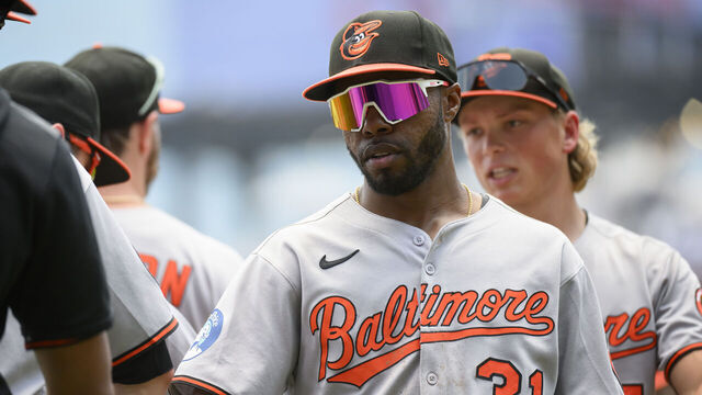 ATLANTA, GEORGIA - JULY 6: Cedric Mullins #31 and Jackson Holliday #7 of the Baltimore Orioles return to the dugout after winning a game against the Atlanta Braves at Truist Park on July 6, 2025 in Atlanta, Georgia.