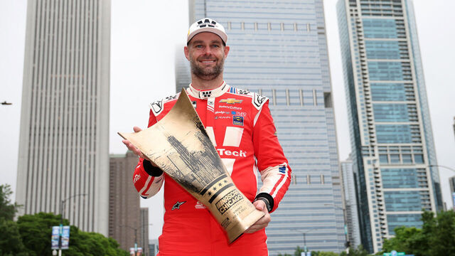 CHICAGO, ILLINOIS - JULY 06: Shane Van Gisbergen, driver of the #88 WeatherTech Chevrolet, poses with the NASCAR Chicago Street Race trophy after winning the NASCAR Cup Series Grant Park 165 at Chicago Street Course on July 06, 2025 in Chicago, Illinois.