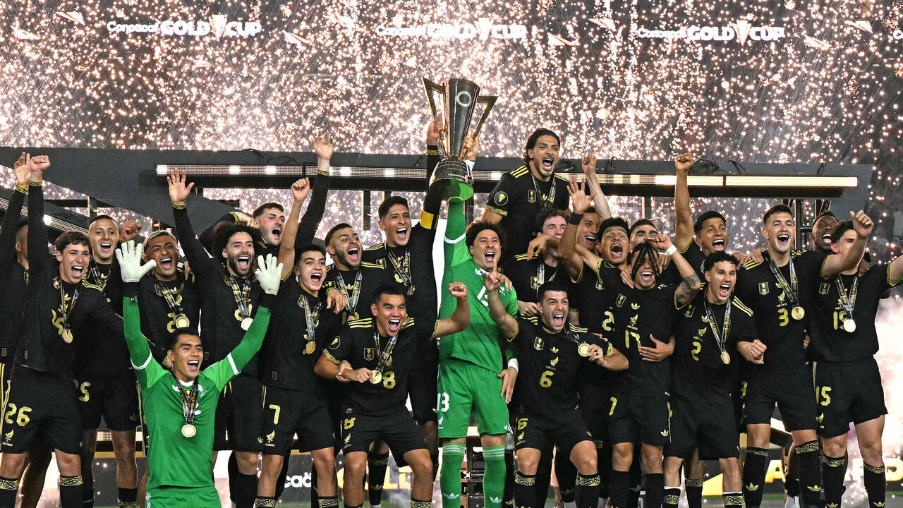 Mexico's players celebrate with the trophy their victory at the end of the Concacaf Gold Cup final football match between Mexico and USA at NRG Stadium in Houston, Texas on July 6, 2025.