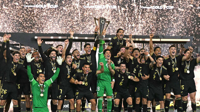 Mexico's players celebrate with the trophy their victory at the end of the Concacaf Gold Cup final football match between Mexico and USA at NRG Stadium in Houston, Texas on July 6, 2025.