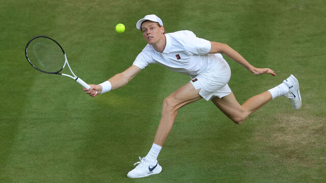 LONDON, ENGLAND - JULY 07: Jannik Sinner of Italy stretches for a forehand against Grigor Dimitrov of Bulgaria during the Gentlemen's Singles fourth round match on day eight of The Championships Wimbledon 2025 at All England Lawn Tennis and Croquet Club on July 07, 2025 in London, England.
