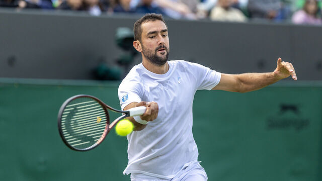 LONDON, ENGLAND - JULY 07: Marin Cilic of Croatia in action against Flavio Cobolli of Italy in the fourth round of the Gentlemen's Singles Competition on Court No. 2 during the Wimbledon Lawn Tennis Championships at the All England Lawn Tennis and Croquet Club at Wimbledon on July 7th, 2025, in London, England.