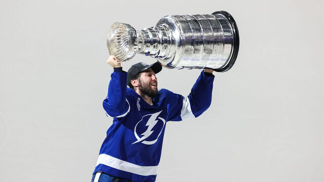 TAMPA, FL - JULY 7: Tyler Johnson #9 of the Tampa Bay Lightning hoists the Stanley Cup overhead after the Tampa Bay Lightning defeated the Montreal Canadiens in Game Five to win the best of seven game series 4-1 during the Stanley Cup Final of the 2021 Stanley Cup Playoffs at Amalie Arena on July 7, 2021 in Tampa, Florida.