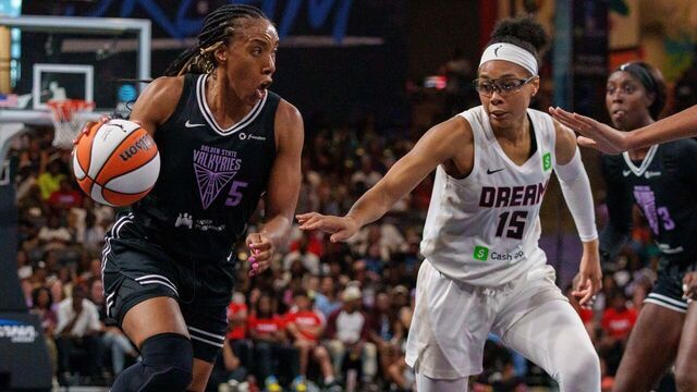 COLLEGE PARK, GEORGIA - JULY 7: Kayla Thornton #5 of the Golden State Valkyries dribbles the ball past Allisha Gray #15 of the Atlanta Dream during a game between the Golden State Valkyries and Atlanta Dream at Gateway Center Arena on July 7, 2025 in College Park, Georgia.