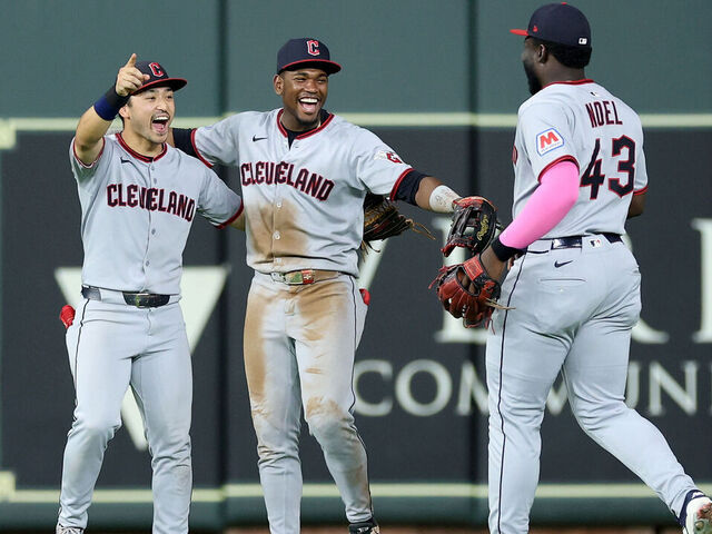HOUSTON, TEXAS - JULY 07: Steven Kwan #38 of the Cleveland Guardians and Angel Martinez #1 celebrate with Jhonkensy Noel #43 after defeating the Houston Astros at Daikin Park on July 07, 2025 in Houston, Texas.