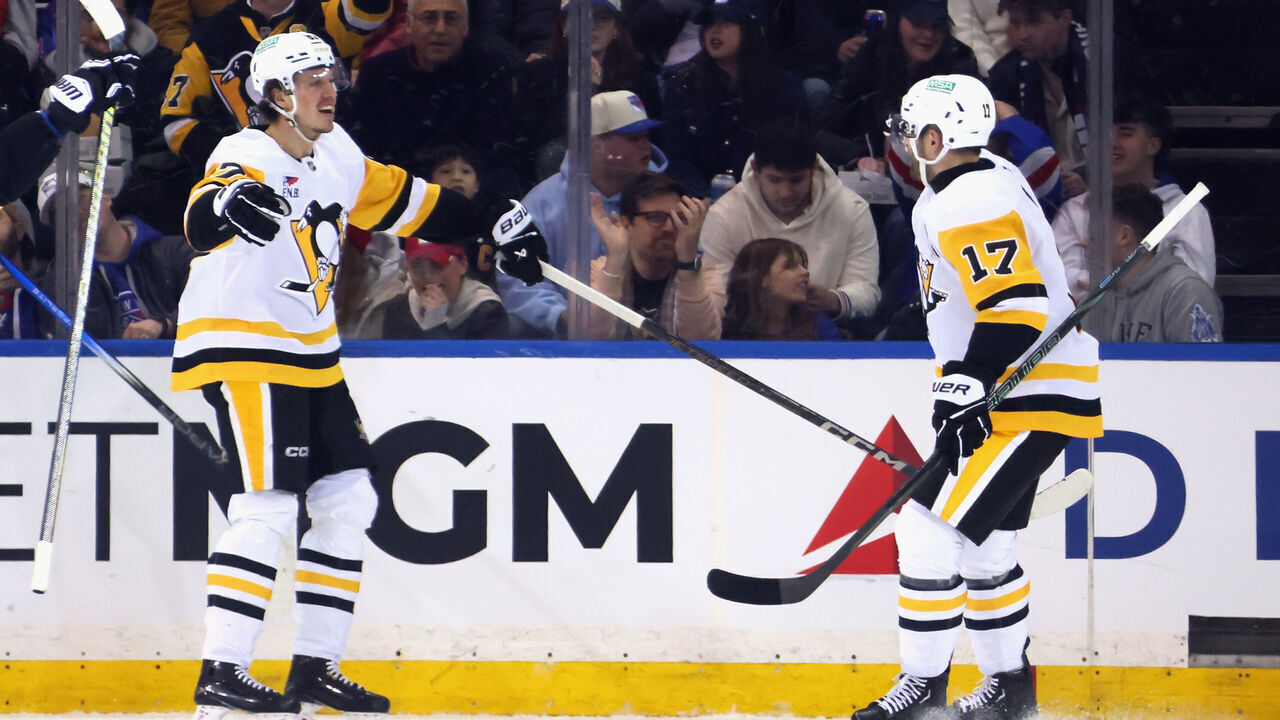 NEW YORK, NEW YORK - FEBRUARY 07: Rickard Rakell #67 of the Pittsburgh Penguins (l) celebrates his second period goal against the New York Rangers and is joined by Bryan Rust #17 (r) at Madison Square Garden on February 07, 2025 in New York City.