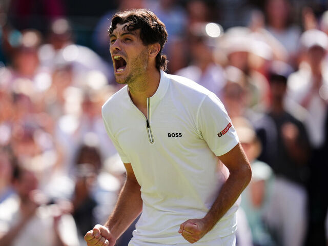 Taylor Fritz celebrates victory over Karen Khachanov following their Gentlemen's Singles match on day nine of the 2025 Wimbledon Championships at the All England Lawn Tennis and Croquet Club, London. Picture date: Tuesday July 8, 2025.