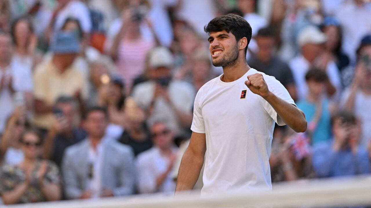 Spain's Carlos Alcaraz celebrates after winning against Britain's Cameron Norrie during their men's singles quarter-final tennis match on the ninth day of the 2025 Wimbledon Championships at The All England Lawn Tennis and Croquet Club in Wimbledon, southwest London, on July 8, 2025.