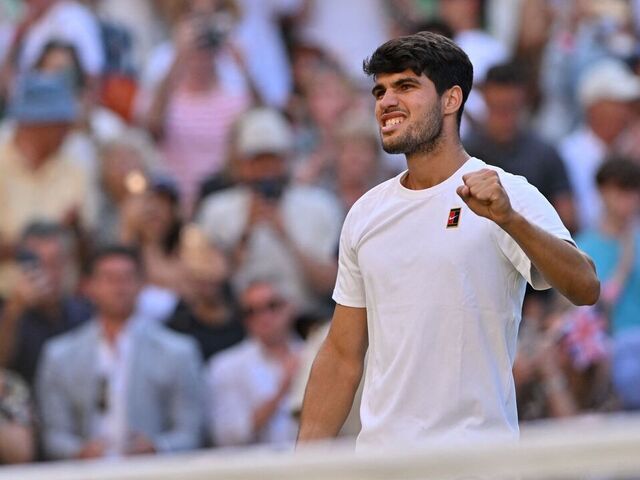 Spain's Carlos Alcaraz celebrates after winning against Britain's Cameron Norrie during their men's singles quarter-final tennis match on the ninth day of the 2025 Wimbledon Championships at The All England Lawn Tennis and Croquet Club in Wimbledon, southwest London, on July 8, 2025.