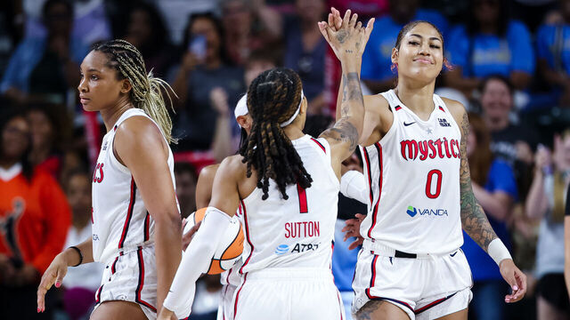 WASHINGTON, DC - JULY 08: Shakira Austin #0 of the Washington Mystics celebrates with Sug Sutton #1 during the second half of the game against the Chicago Sky at EagleBank Arena on July 8, 2025 in Fairfax, Virginia.