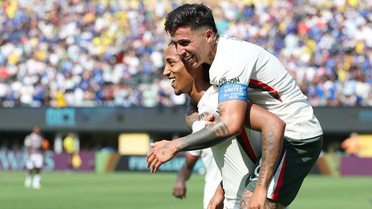 EAST RUTHERFORD, NEW JERSEY - JULY 08: Joao Pedro of Chelsea FC celebrates after scoring his team's second goal with teammate Enzo Fernandez #8 during the FIFA Club World Cup 2025 semi-final match between Fluminense FC and Chelsea FC at MetLife Stadium on July 08, 2025 in East Rutherford, New Jersey.