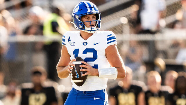 ORLANDO, FLORIDA - OCTOBER 26: Jake Retzlaff #12 of the Brigham Young Cougars looks to pass against the UCF Knights at FBC Mortgage Stadium on October 26, 2024 in Orlando, Florida.