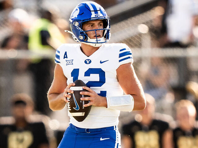 ORLANDO, FLORIDA - OCTOBER 26: Jake Retzlaff #12 of the Brigham Young Cougars looks to pass against the UCF Knights at FBC Mortgage Stadium on October 26, 2024 in Orlando, Florida.
