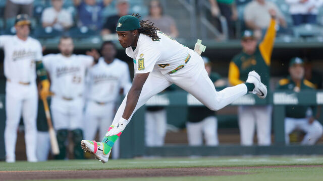 SACRAMENTO, CALIFORNIA - JULY 08: Lawrence Butler #4 of the Athletics slides into home plate to score an inside-the-park home run in the bottom of the first inning against the Atlanta Braves at Sutter Health Park on July 08, 2025 in Sacramento, California.