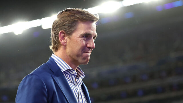 EAST RUTHERFORD, NEW JERSEY - OCTOBER 13: Eli Manning looks on before the game between the New York Giants and the Cincinnati Bengals at MetLife Stadium on October 13, 2024 in East Rutherford, New Jersey.