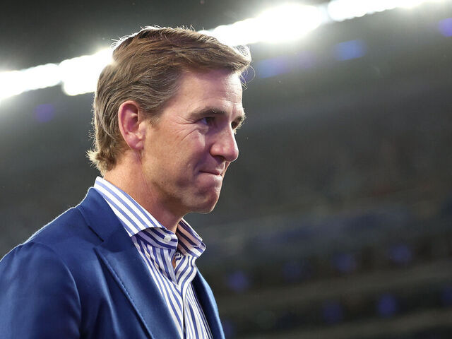 EAST RUTHERFORD, NEW JERSEY - OCTOBER 13: Eli Manning looks on before the game between the New York Giants and the Cincinnati Bengals at MetLife Stadium on October 13, 2024 in East Rutherford, New Jersey.