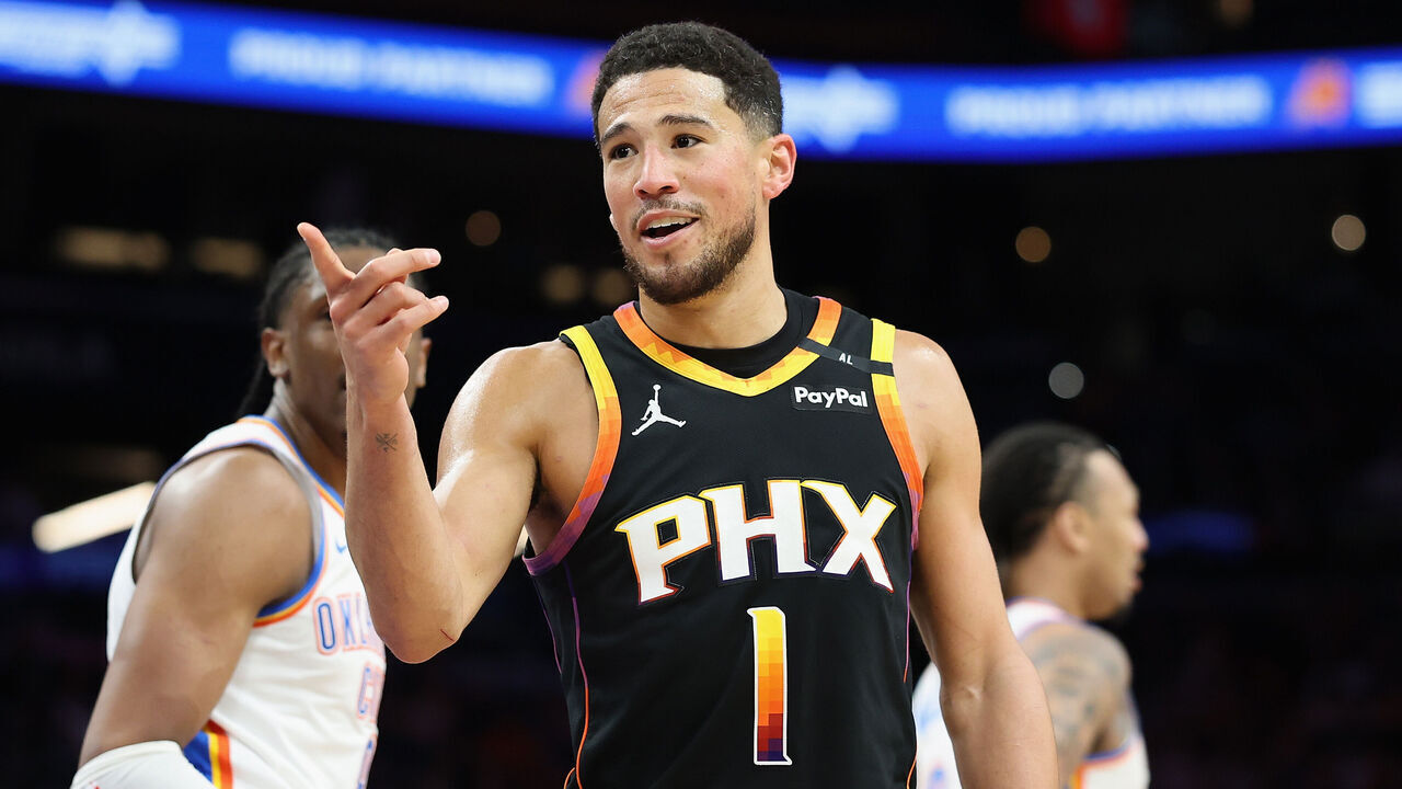 PHOENIX, ARIZONA - APRIL 09: Devin Booker #1 of the Phoenix Suns reacts during the second half of the NBA game at PHX Arena on April 09, 2025 in Phoenix, Arizona.