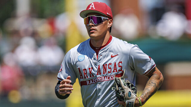 FAYETTEVILLE, ARKANSAS - JUNE 08: Wehiwa Aloy #9 of the Arkansas Razorbacks jogs to the dugout during a game against the Tennessee Volunteers at Baum-Walker Stadium at George Cole Field during the NCAA Baseball Super Regional - Fayetteville on June 08, 2025 in Fayetteville, Arkansas. The Razorbacks defeated the Volunteers 11-4.