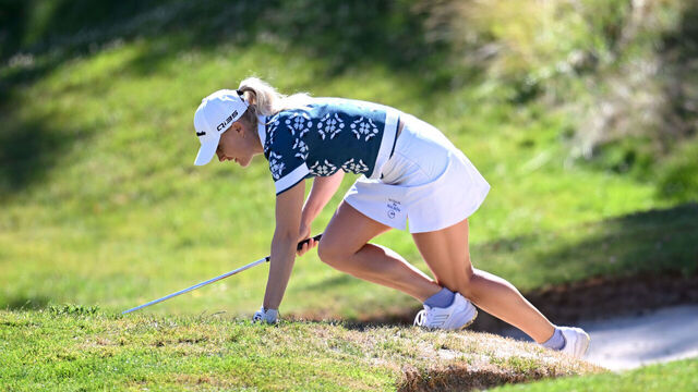 EVIAN-LES-BAINS, FRANCE - JULY 10: Charley Hull of England falls as she climbs out of a bunker on the third hole, before later withdrawing from play, during Round One of The Amundi Evian Championship 2025 at Evian Resort Golf Club on July 10, 2025 in Evian-les-Bains, France.