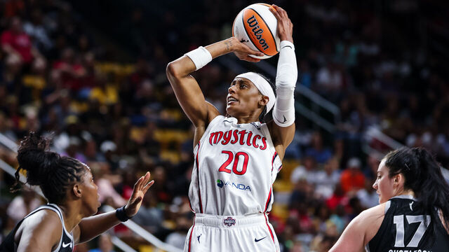WASHINGTON, DC - JULY 10: Brittney Sykes #20 of the Washington Mystics shoots the ball over Chelsea Gray #12 of the Las Vegas Aces during the second half of the game at EagleBank Arena on July 10, 2025 in Fairfax, Virginia.