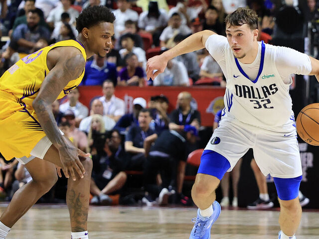 LAS VEGAS, NEVADA - JULY 10: Cooper Flagg #32 of the Dallas Mavericks drives against DaJuan Gordon #45 of the Los Angeles Lakers in the second half of a 2025 NBA Summer League game at the Thomas & Mack Center on July 10, 2025 in Las Vegas, Nevada.