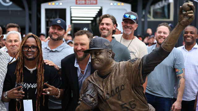 CHICAGO, ILLINOIS - JULY 11: Former Chicago White Sox pitcher Mark Buehrle and members of the 2005 World Series winning Chicago White Sox team pose for a picture in front of a statue unveiled in Buehrle's honor before game two of a doubleheader against the Cleveland Guardians at Rate Field on July 11, 2025 in Chicago, Illinois.