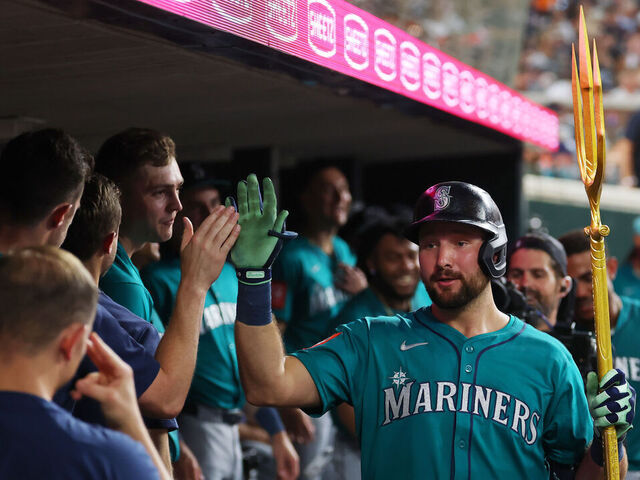 DETROIT, MICHIGAN - JULY 11: Cal Raleigh #29 of the Seattle Mariners celebrates his eighth inning home run with teammates while playing the Detroit Tigers at Comerica Park on July 11, 2025 in Detroit, Michigan.