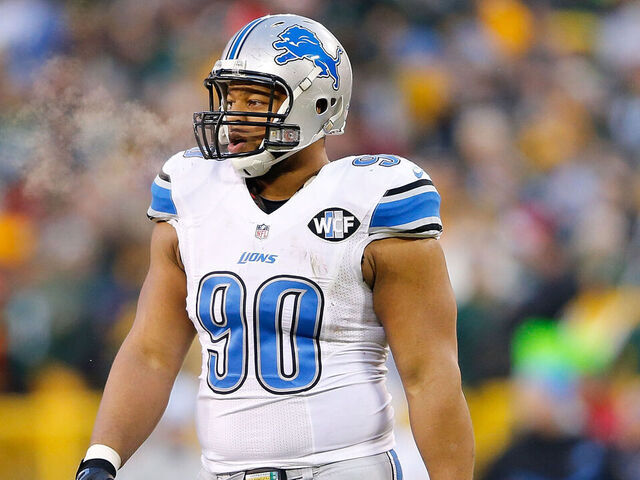 GREEN BAY, WI - DECEMBER 28: Ndamukong Suh #90 of the Detroit Lions looks to the sidelines duing the second quarter of the game against the Green Bay Packers at Lambeau Field on December 28, 2014 in Green Bay, Wisconsin. The Packers defeated the Lions 30-20.