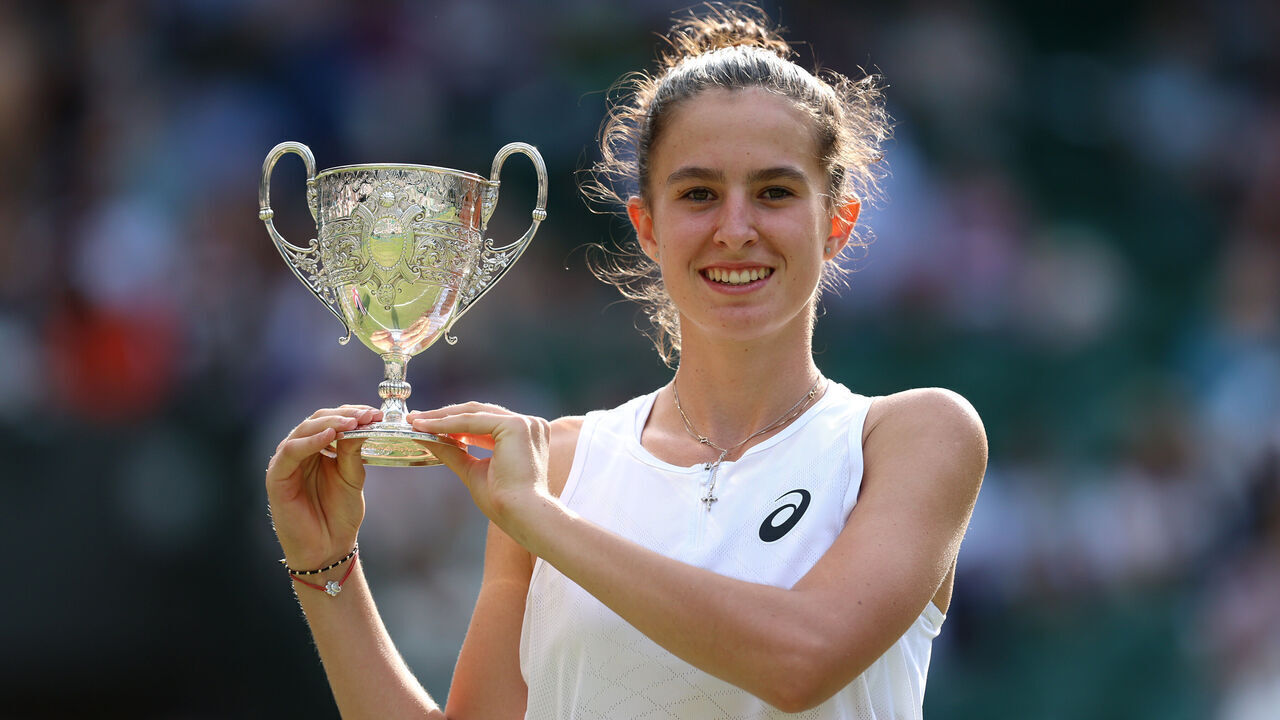 LONDON, ENGLAND - JULY 12: Mia Pohankova of Slovakia poses for a photo with the Girl's Singles Trophy following victory against Julieta Pareja of United States in the Girl's singles final on day thirteen of The Championships Wimbledon 2025 at All England Lawn Tennis and Croquet Club on July 12, 2025 in London, England.