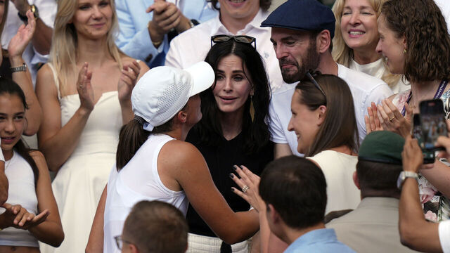 Courteney Cox and Johnny McDaid celebrate with Iga Swiatek following the Ladies' Singles Final on day thirteen of the 2025 Wimbledon Championships at the All England Lawn Tennis and Croquet Club, London. Picture date: Saturday July 12, 2025.