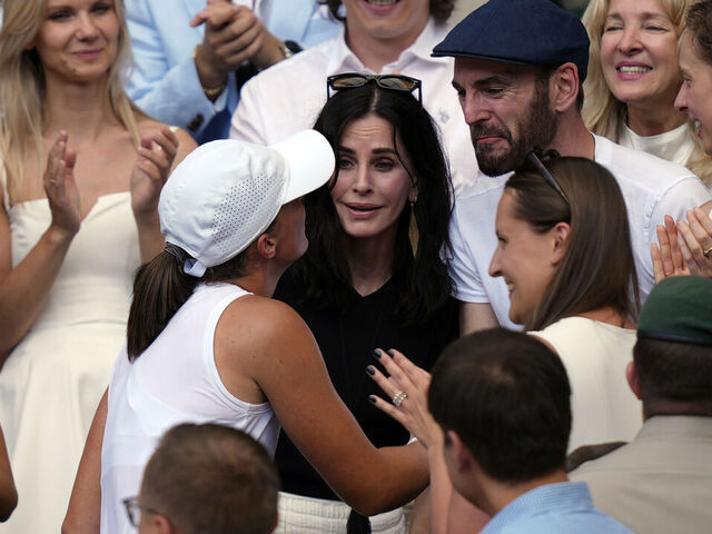 Courteney Cox and Johnny McDaid celebrate with Iga Swiatek following the Ladies' Singles Final on day thirteen of the 2025 Wimbledon Championships at the All England Lawn Tennis and Croquet Club, London. Picture date: Saturday July 12, 2025.