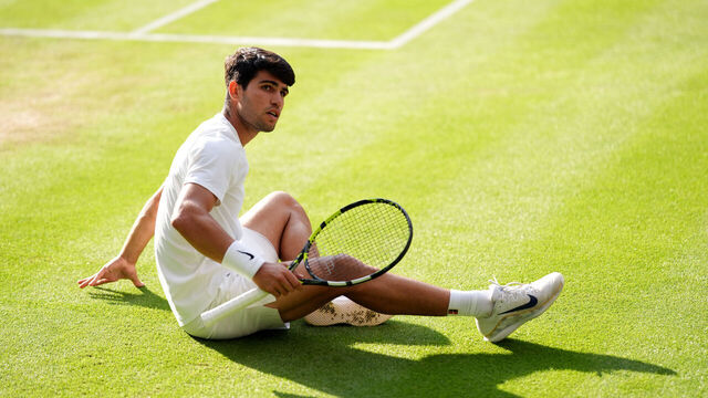 Carlos Alcaraz slips during his Gentlemen's Singles Final against Jannik Sinner on day fourteen of the 2025 Wimbledon Championships at the All England Lawn Tennis and Croquet Club, London. Picture date: Sunday July 13, 2025.