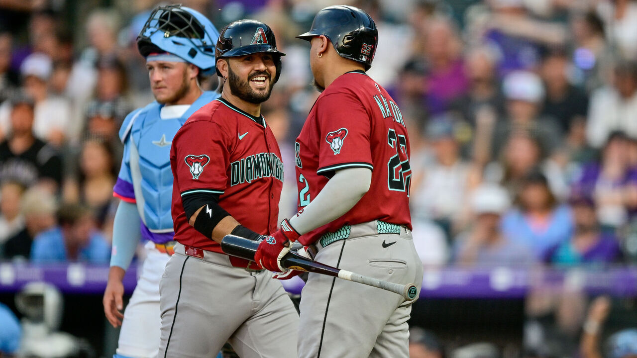 DENVER, CO - JUNE 20: Arizona Diamondbacks third baseman Eugenio Suarez (28) celebrates with first baseman Josh Naylor (22) after his fifth inning solo home run during a game between the Arizona Diamondbacks and the Colorado Rockies at Coors Field on June 20, 2025 in Denver, Colorado.