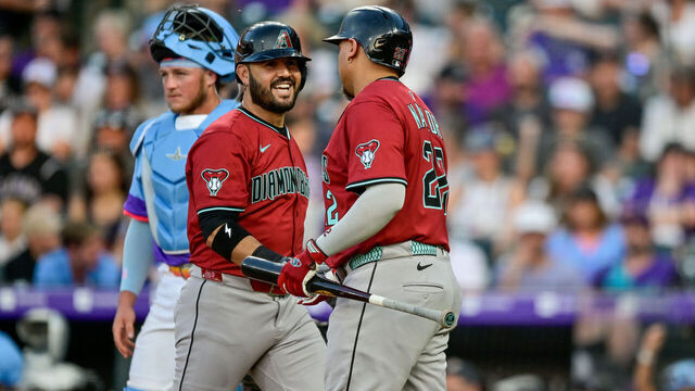 DENVER, CO - JUNE 20: Arizona Diamondbacks third baseman Eugenio Suarez (28) celebrates with first baseman Josh Naylor (22) after his fifth inning solo home run during a game between the Arizona Diamondbacks and the Colorado Rockies at Coors Field on June 20, 2025 in Denver, Colorado.
