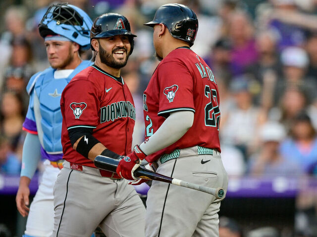 DENVER, CO - JUNE 20: Arizona Diamondbacks third baseman Eugenio Suarez (28) celebrates with first baseman Josh Naylor (22) after his fifth inning solo home run during a game between the Arizona Diamondbacks and the Colorado Rockies at Coors Field on June 20, 2025 in Denver, Colorado.