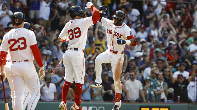 BOSTON, MA - JULY 13: Ceddanne Rafaela #3 of the Boston Red Sox is congratulated by Marcelo Mayer #39 after his two-run home run against the Tampa Bay Rays during the sixth inning at Fenway Park on July 13, 2025 in Boston, Massachusetts.