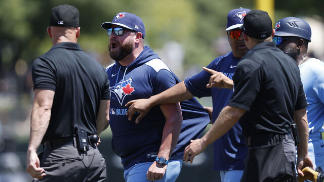 SACRAMENTO, CALIFORNIA - JULY 13: Manager John Schneider #14 of the Toronto Blue Jays talks to the umpires after being ejected in the top of the fifth inning against the Athletics at Sutter Health Park on July 13, 2025 in Sacramento, California.