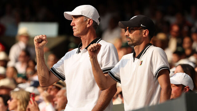 LONDON, ENGLAND - JULY 13: Darren Cahill and Simone Vagnozzi, Coaches of Jannik Sinner celebrate from the player's box as Jannik Sinner of Italy plays against Carlos Alcaraz of Spain in the Gentleman's Singles Final on day fourteen of The Championships Wimbledon 2025 at All England Lawn Tennis and Croquet Club on July 13, 2025 in London, England.