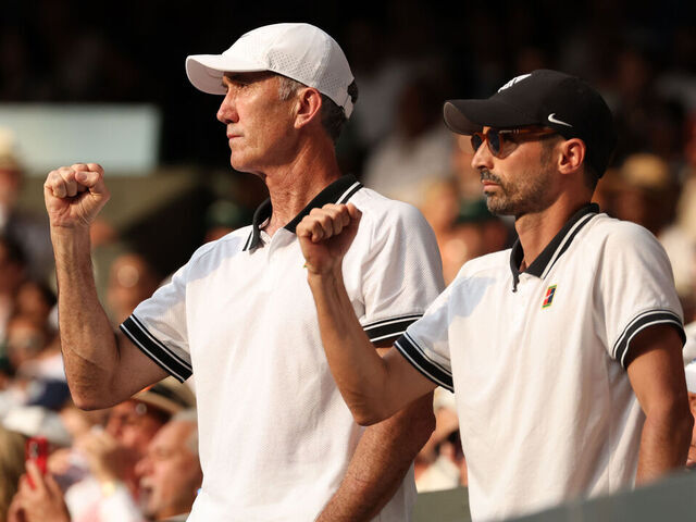 LONDON, ENGLAND - JULY 13: Darren Cahill and Simone Vagnozzi, Coaches of Jannik Sinner celebrate from the player's box as Jannik Sinner of Italy plays against Carlos Alcaraz of Spain in the Gentleman's Singles Final on day fourteen of The Championships Wimbledon 2025 at All England Lawn Tennis and Croquet Club on July 13, 2025 in London, England.