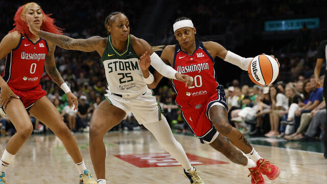 SEATTLE, WASHINGTON - JULY 13: Brittney Sykes #20 of the Washington Mystics dribbles the ball against Tiffany Mitchell #25 of the Seattle Storm during the fourth quarter of the game at Climate Pledge Arena on July 13, 2025 in Seattle, Washington. The Washington Mystics won 74-69.