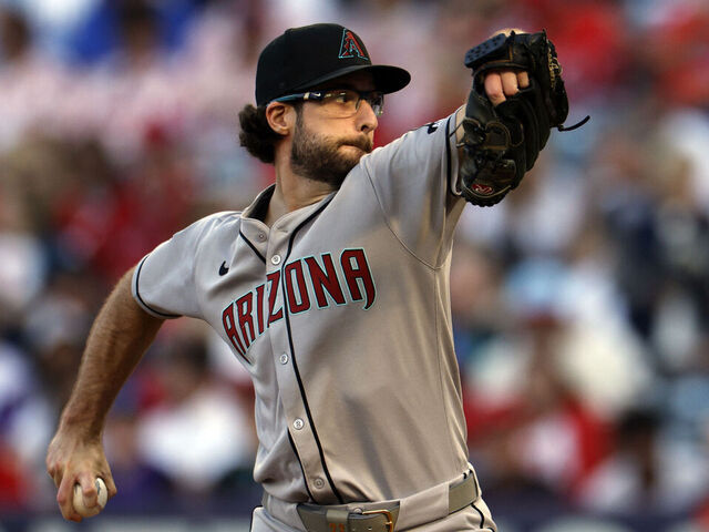 ANAHEIM, CALIFORNIA - JULY 12: Zac Gallen #23 of the Arizona Diamondbacks throws against Los Angeles Angels during the third inning of a baseball game at Angel Stadium of Anaheim on July 12, 2025 in Anaheim, California.