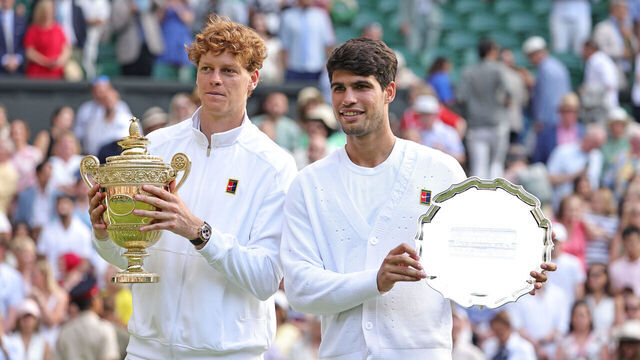 LONDON, ENGLAND - JULY 13: First-placed Jannik Sinner of Italy and second-placed Carlos Alcaraz of Spain pose with the trophies during the award ceremony following the Gentlemen's Singles Final match on day fourteen of 2025 Wimbledon Championships at All England Lawn Tennis and Croquet Club on July 13, 2025 in London, England.