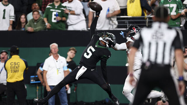 EAST RUTHERFORD, NEW JERSEY - OCTOBER 31: Garrett Wilson #5 of the New York Jets catches a pass to score a touchdown during the second half of an NFL football game against the Houston Texans, at MetLife Stadium on October 31, 2024 in East Rutherford, New Jersey.