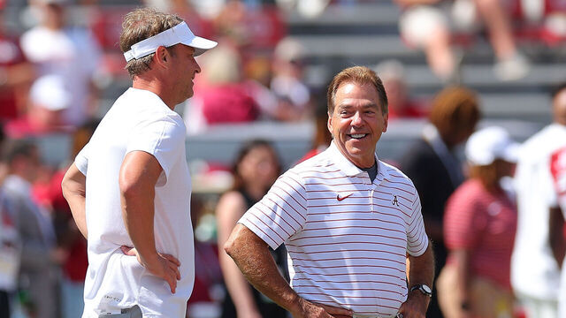 TUSCALOOSA, ALABAMA - SEPTEMBER 23: Head coach Nick Saban of the Alabama Crimson Tide and head coach Lane Kiffin of the Mississippi Rebels converse prior to their game at Bryant-Denny Stadium on September 23, 2023 in Tuscaloosa, Alabama.